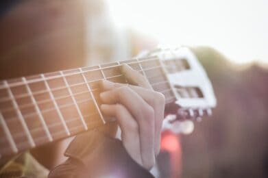 Photo by Facundo Aranda person playing guitar